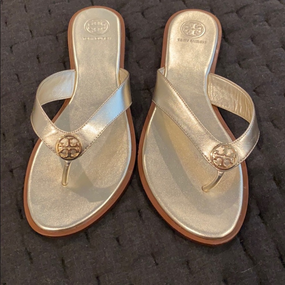 Tory Burch gold sandals.